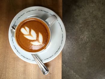 Close-up of coffee cup on table