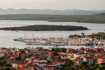 High angle view of townscape by sea