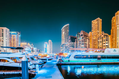 Illuminated buildings in city at night