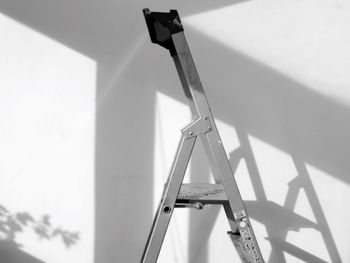 Low angle view of ladder on wall