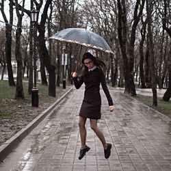 Woman with umbrella in rain