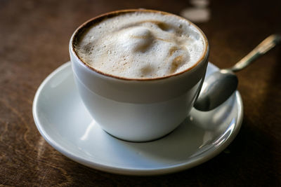 Close-up of coffee cup on table