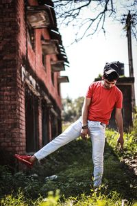 Full length of young man standing on street