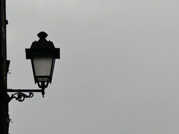 Low angle view of street light against sky