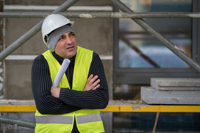 Man wearing reflective clothing at construction site