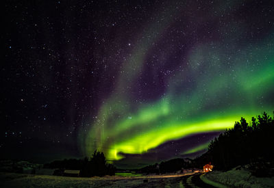 Aurora polaris over land at night