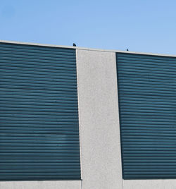 Low angle view of building against blue sky