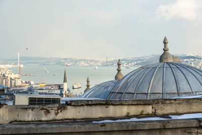 Panoramic view of buildings and city against sky