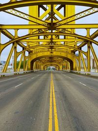 Surface level of road against bridge in city