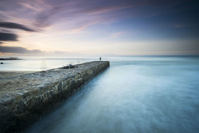 Scenic view of sea against sky during sunrise