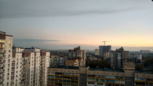 Cityscape against sky during sunset