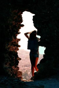 Woman standing in the dark