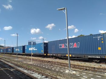 Train at railroad station against sky