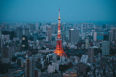 Aerial view of illuminated buildings in city