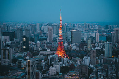 Aerial view of illuminated buildings in city