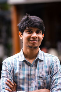Portrait of young man looking away