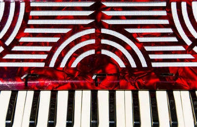 Reflection of man on mirror in piano