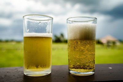 Close-up of beer glass on table