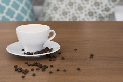 Close-up of coffee cup on table