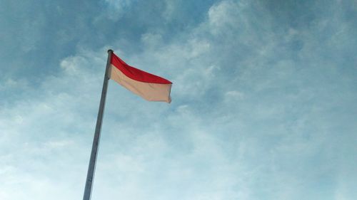 Low angle view of flag against sky