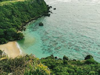 High angle view of rocks by sea