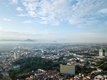 Aerial view of cityscape against sky