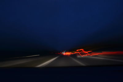 Light trails on road at night