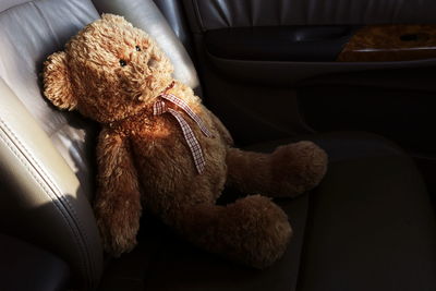 High angle view of teddy bear on car seat