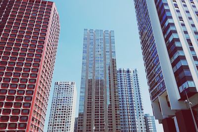 Low angle view of modern buildings against clear sky