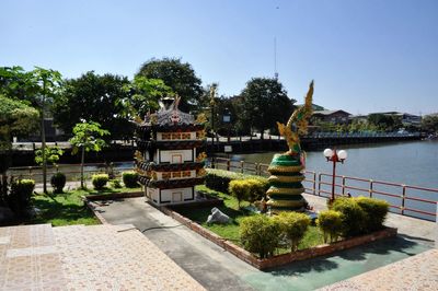 Fountain in front of building against clear sky