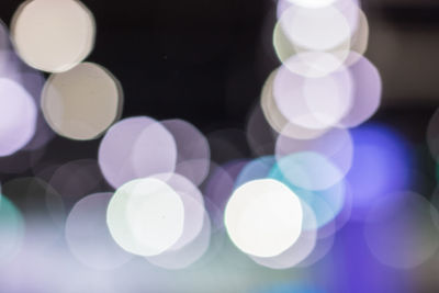 Defocused image of illuminated lights at night