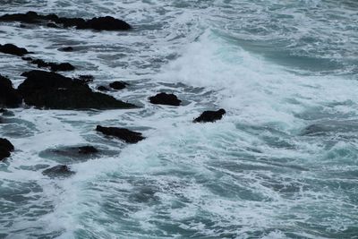 High angle view of waves in sea