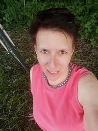 High angle portrait of smiling woman on field