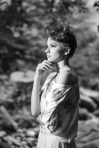 Side view of young woman looking away