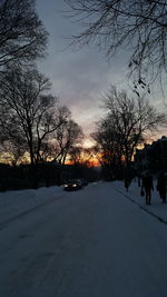 Road passing through snow covered landscape