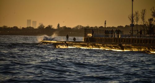 Scenic view of sea against clear sky during sunset