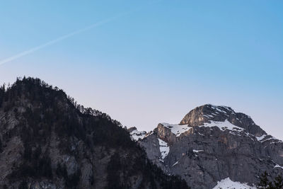 Scenic view of snowcapped mountains against clear blue sky