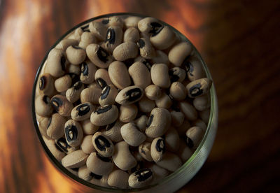 High angle view of black-eyed peas in glass bowl on table