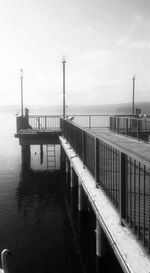 Pier on sea against sky