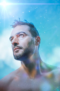 Portrait of young man swimming in sea