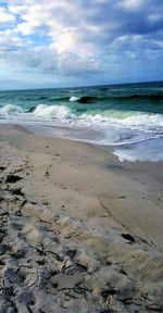 Scenic view of beach against sky