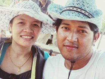 Portrait of smiling couple wearing hat