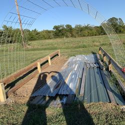 Cat on field against clear sky