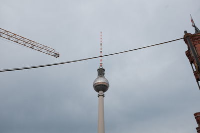 Low angle view of fernsehturm against sky in city