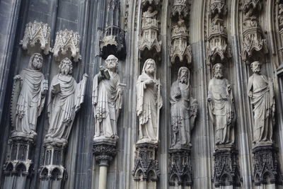 Panoramic shot of statues on building outside temple