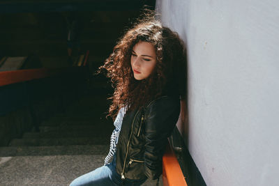 Young woman sitting in hair