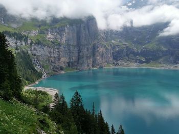 Scenic view of lake and mountains against sky