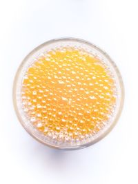 Directly above shot of breakfast in bowl against white background