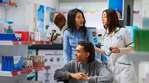 Portrait of female friends working at clinic