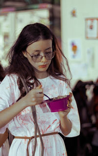 Portrait of a girl in a halloween costume with food.